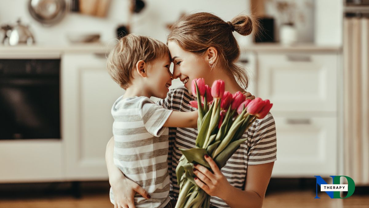 Mother holds her child and flowers.