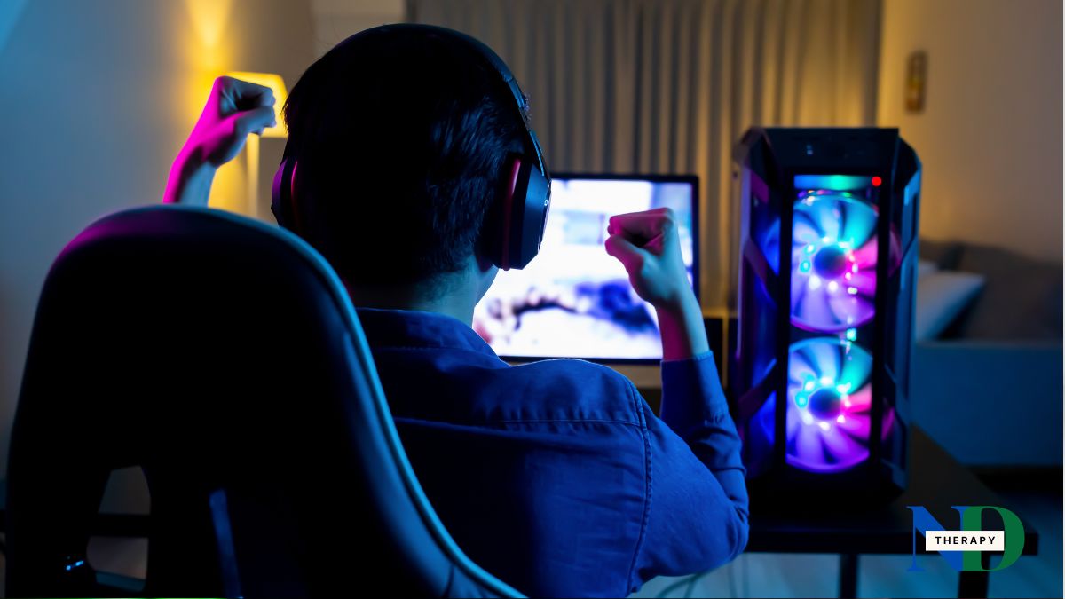 Teen gaming on gaming computer.
