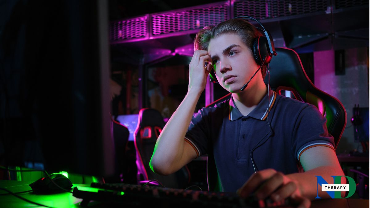 Teen gaming while wearing a headset.