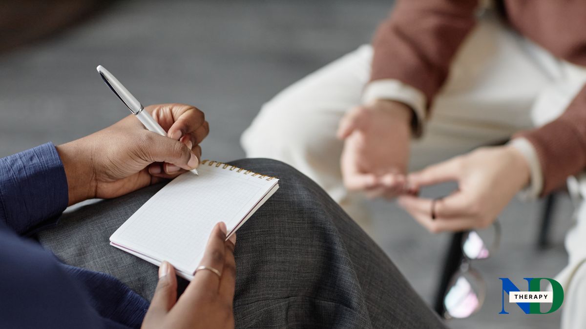 A therapist taking notes.