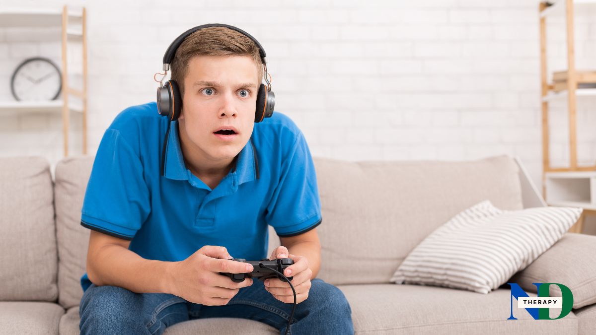 Male teen playing video games.