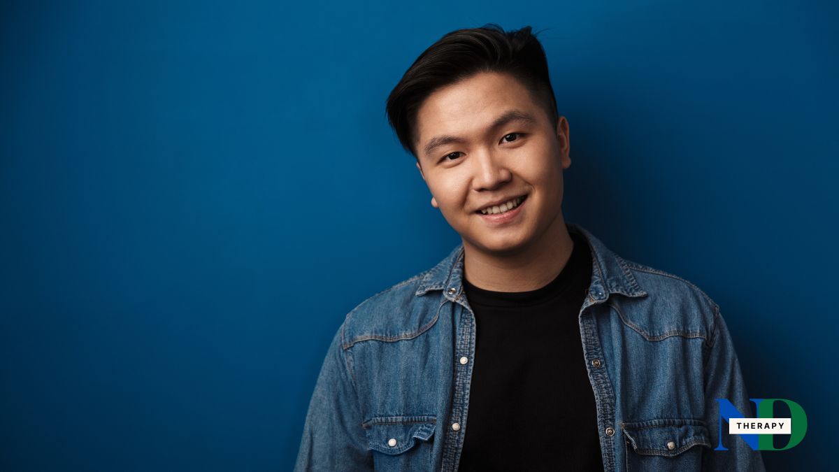 asian-male-smiling-blue Asian male on a blue background.