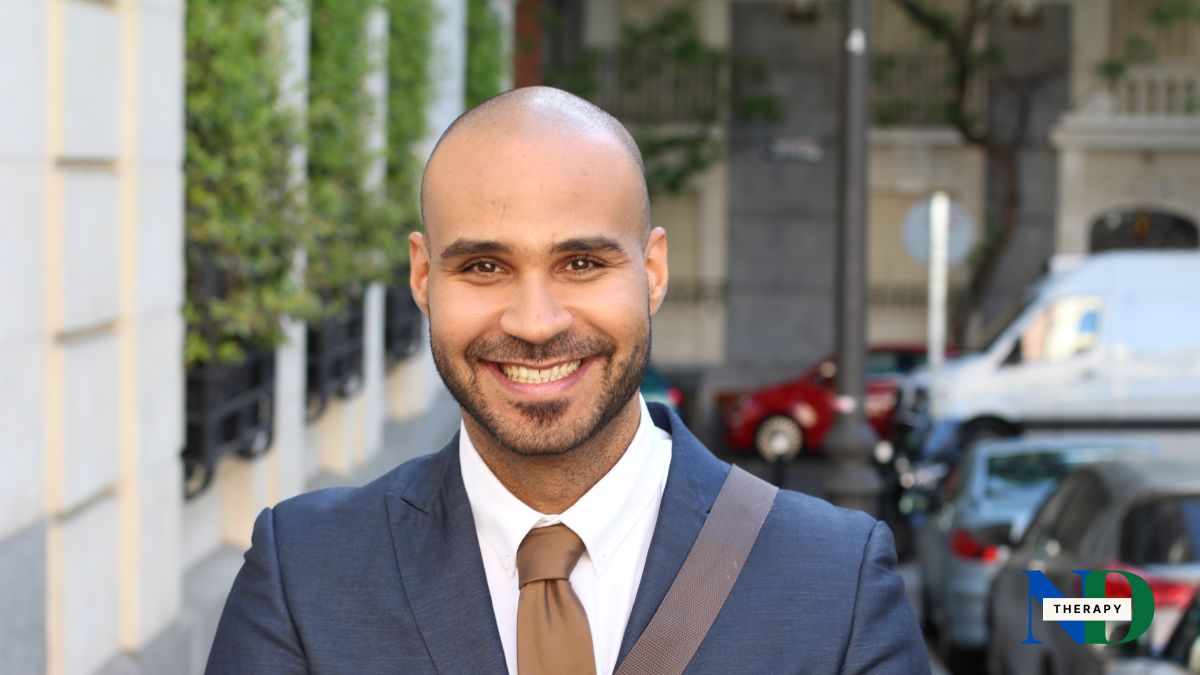 bald-man-suit-smiling A bald man wearing a suit smiling.