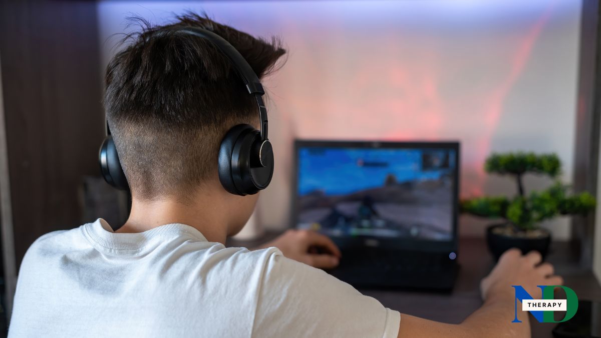 Male teen playing video games.