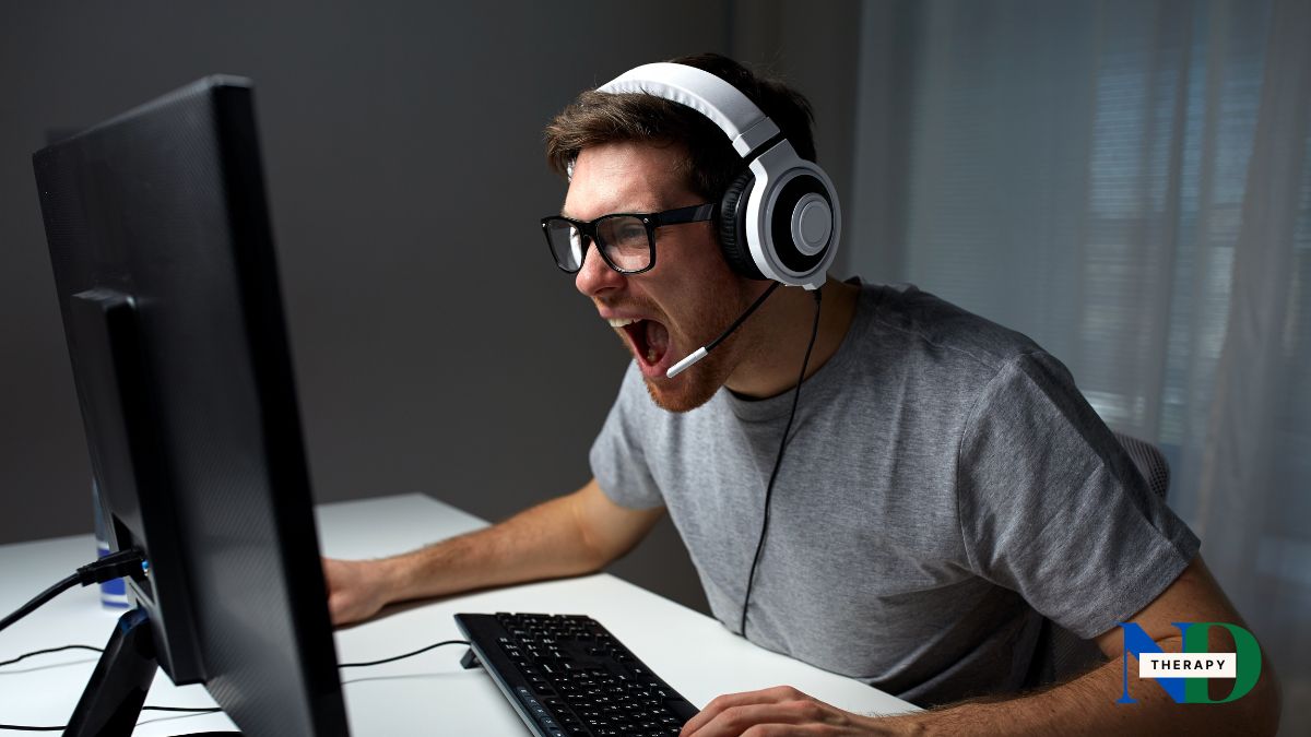 Man wearing a headset is angry while gaming.
