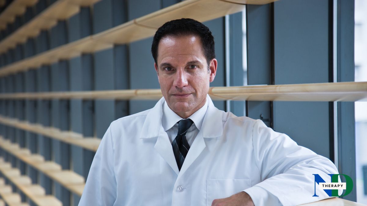 A male researcher with a serious gaze.
