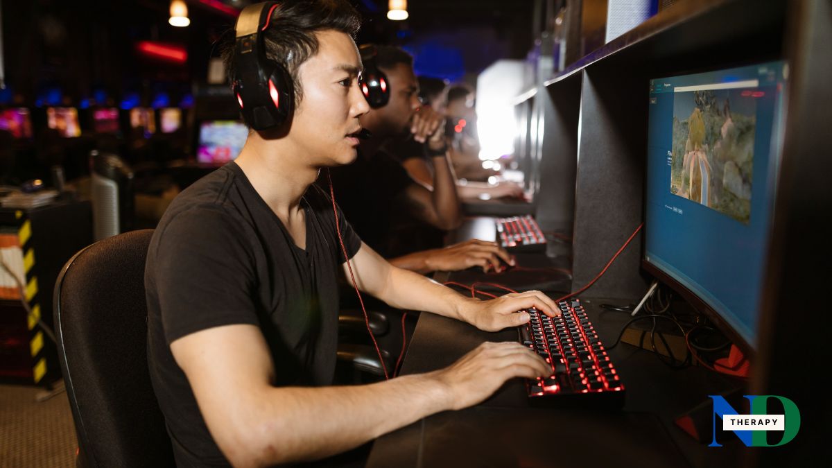 An adult male gaming.