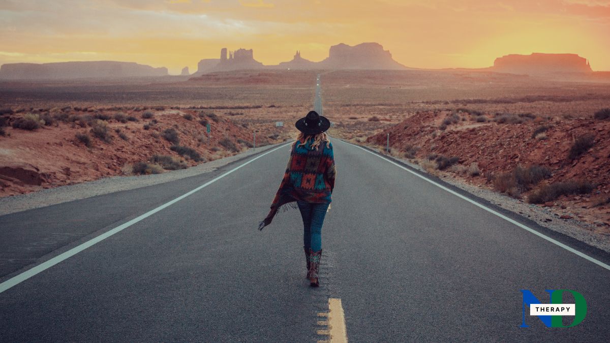 Woman walking down road to a new life.